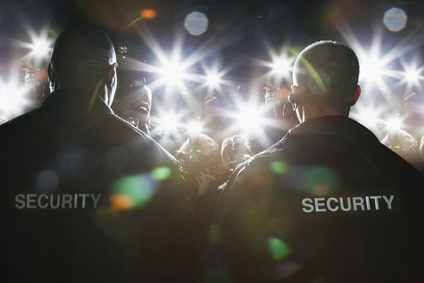 Security guards blocking paparazzi
